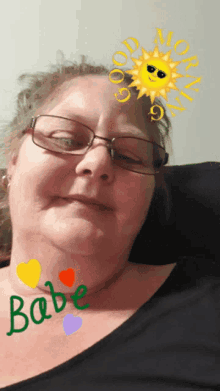 a woman wearing glasses has the word babe written on her neck