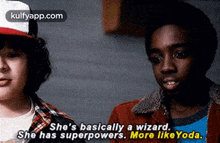 a couple of boys are standing next to each other and one of them is talking about a wizard .