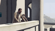 a man and a monkey are standing on a balcony with a sign that says once