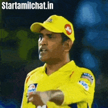 a man wearing a yellow shirt and a yellow hat with jio written on it