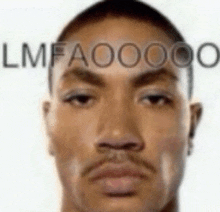 a close up of a man 's face with the words `` lmfaoooo '' written on his forehead .