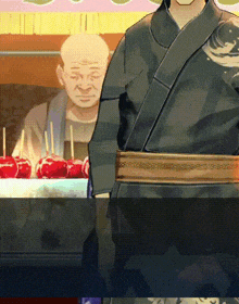 a man in a kimono stands in front of a display of candy apples