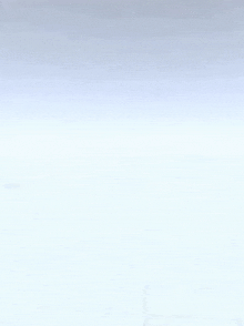 a person 's hands are reaching out towards a white object in the air .