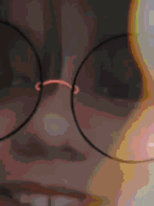 a close up of a girl 's face with a cat ear on her head
