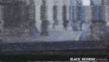 a black monday showtime poster with a blurry image
