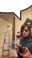 a person is holding a lighter in front of a bottle that says coca cola