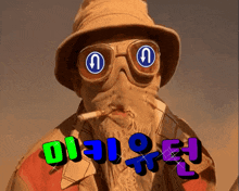 a man with a beard wearing a hat and goggles smoking a cigarette with a foreign language behind him