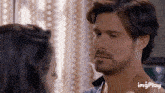 a man and a woman are looking into each other 's eyes and the word imgplay is on the bottom