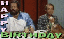 two men sitting at a table with the words happy birthday written on it