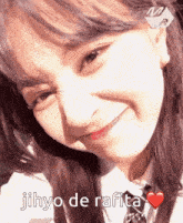 a close up of a girl 's face with the words jihyo de rafita on the bottom
