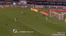a soccer game is being played on a field with advertisements for coca cola and ringo ringo