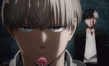 a man with a lollipop in his mouth stands next to a man with blood on his face