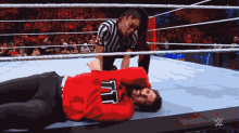 a wrestler with the number 7 on his shirt
