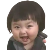 a baby with short hair is smiling and looking at the camera on a white background .