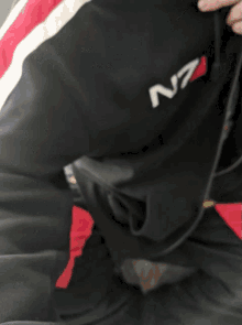 a man wearing a hoodie with n7 on it