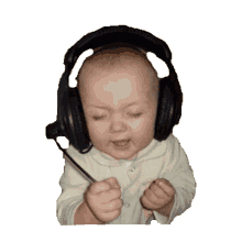 baby headphones shake eyes closed