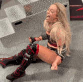a woman wearing knee pads that say broquel finn
