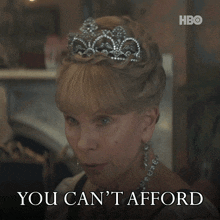 a woman with a tiara on her head says you can t afford