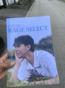a book titled pup src rage select with a picture of a man laying in the grass