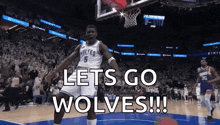 a basketball player is jumping in the air with the words `` let 's go wolves '' written on the screen .