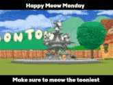 a happy meow monday sign with a fountain in the foreground