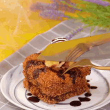 a fork is being used to cut a piece of fried food