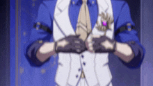 a man in a suit and tie is holding his hands together