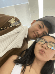 a man and a woman are posing for a picture together