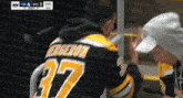 a man wearing a jersey that says bergeron on it