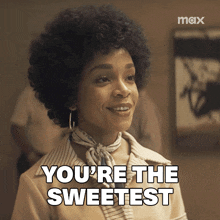 a woman with an afro says you 're the sweetest on a screen