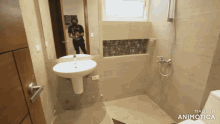 a bathroom with a sink and a shower is made in animatica