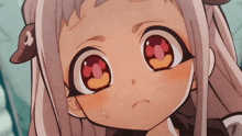a close up of a cartoon character 's face with big red eyes