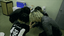 a person wearing a misfits shirt is kneeling down
