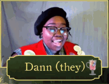 a woman wearing glasses and a red vest with the name dann on it