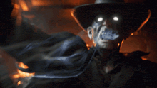 a close up of a man wearing a cowboy hat looking up
