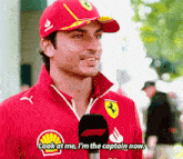 a man wearing a red hat and a red jacket says look at me i 'm the captain now .