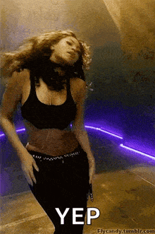 a gif of a woman dancing with the word yep in the bottom right corner