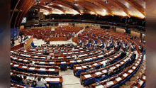 a large room with a lot of tables and chairs in it