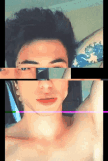 a young man without a shirt has a tattoo on his arm