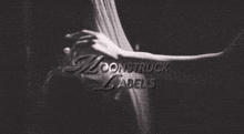 a black and white photo with the words moonstruck label 's written on it