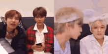 two young men are sitting next to each other on a couch . one of the men is wearing a headband .