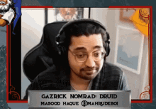 gazrick nomrad druid masood haque @mahrudeboi looks at the camera while wearing headphones