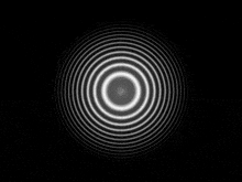 a black background with white circles in it