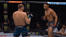 two men are fighting in a boxing ring with a toyo tires ad in the background