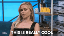 a woman says " this is really cool " in front of an imdb logo