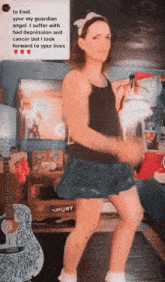 a woman dancing in front of a guitar that says must
