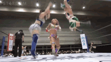 a woman in a wrestling ring with a sign that says ' stardom ' on it
