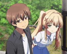 a boy and a girl are standing next to each other and the girl has a cross on her hair