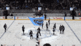 a group of hockey players on the ice with a banner that says ' key nash ' on it