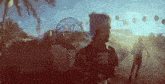 a man in a plaid shirt stands in front of a ferris wheel